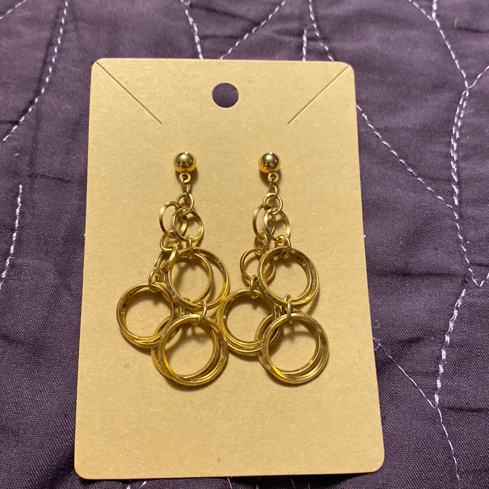Gold earrings with a cluster of dangly rings